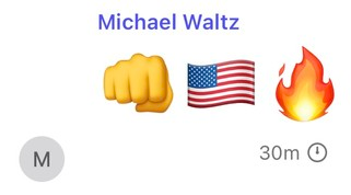 Chat message from Michael Waltz showing a fist, the USA flag and a fire emoji